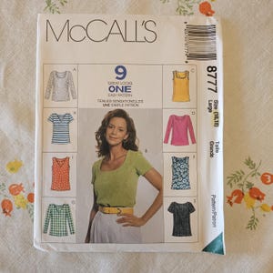 May include: A McCall's 8777 sewing pattern envelope for size Large (16,18). The front features the text 9 GREAT LOOKS ONE EASY PATTERN and displays illustrations of nine different top variations, including long-sleeve, short-sleeve, and sleeveless styles.