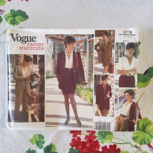 May include: Vogue career wardrobe sewing pattern, number 2718, size table 6-8-10. The pattern shows five different outfits for women, including a burgundy blazer and skirt, a brown dress, a white blouse with a brown skirt, a brown blazer with a brown skirt, and a white blouse with a brown skirt and a cardigan.