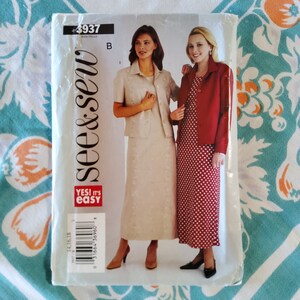 May include: A sewing pattern for two dresses, one with a polka dot print and the other with a solid color. The pattern is from the brand "See & Sew" and is labeled "Yes! It's Easy".