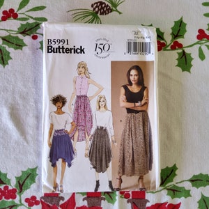 May include: A sewing pattern for a skirt with three different styles. The pattern is from Butterick and is for sizes Large, Extra Large, and Extra Extra Large. The pattern is for a skirt with a high waist and a flowing skirt.