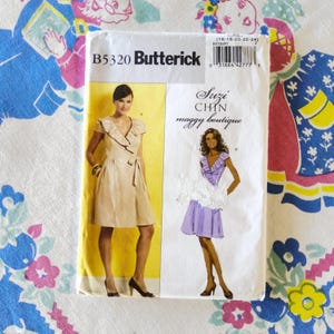 May include: A vintage Butterick sewing pattern, B5320, featuring illustrations of two dresses. The pattern is for a Suzi Chin maggy boutique design. The cover is white with yellow and black text and images of the dresses.