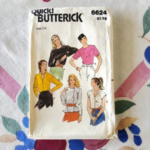 May include: Vintage Butterick sewing pattern 6624, size 14, featuring illustrations of women's blouses. The pattern envelope is off-white with the text "QUICK! BUTTERICK" at the top. The illustrations depict various blouse styles in different colors.