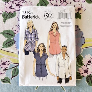 May include: Butterick sewing pattern B5924 featuring four shirt variations. The envelope displays illustrations of a plaid shirt, a sleeveless collared top, a short-sleeved button-down, and a long-sleeved shirt. Includes size C5 10-12-14-16-18.