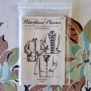 May include: A sewing pattern for an alpine jacket, featuring three different views. The pattern is designed for Polarfleece fabric and is labeled "#1000" and "Polarfleece Pizzazz".