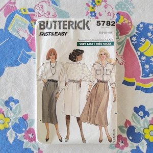 May include: A Butterick 5782 sewing pattern envelope for sizes 14-16-18, labeled Fast & Easy. The front displays illustrations of three outfits featuring blouses and skirts, with sewing rating Very Easy/Très Facile printed on the white paper cover.