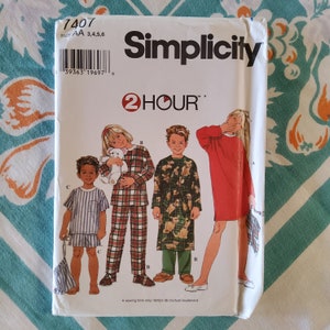 May include: Simplicity sewing pattern number 7407 for children's pajamas and a robe. The pattern includes three different styles: a red long-sleeved shirt, a plaid pajama set, and a robe with a woodland print. The pattern is labeled "2 Hour" and includes sizes AA 3, 4, 5, and 6.