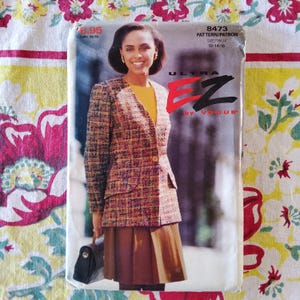 May include: A vintage sewing pattern by Vogue, featuring a woman wearing a tweed blazer and skirt. The pattern is labeled "ULTRA EZ" and includes sizes 12-14-16. The price tag shows $8.95.