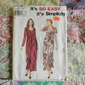 May include: A Simplicity sewing pattern envelope, number 9159, featuring illustrations of two floor-length dresses with scoop necklines. One dress has long sleeves and a dark floral print, while the other has short sleeves and a light floral print.