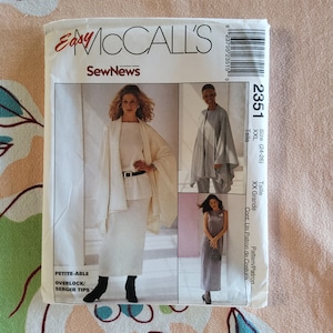 May include: A sewing pattern for a long skirt and a wrap top. The pattern is for sizes 24-26 and is labeled as 'Easy McCall's SewNews' and 'Petite-Able Overlock/Serger Tips'.