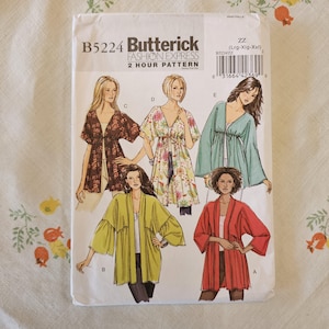 May include: A Butterick Fashion Express B5224 sewing pattern envelope for a 2 hour pattern. The front displays illustrations of five variations of a loose-fitting jacket or top in different colors and patterns, labeled A through E, with size ZZ.