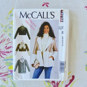 May include: A McCall's M7877 sewing pattern envelope for jackets in sizes 6-8-10-12-14. The front displays illustrations of four jacket variations and a photograph of a person wearing a two-tone jacket with white faux-shearling and metallic fabric.