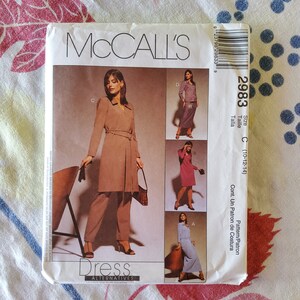 May include: McCall's sewing pattern for a dress, pattern number 2983, size C (10-12-14). The pattern includes instructions for making a dress with a long skirt and a matching jacket.