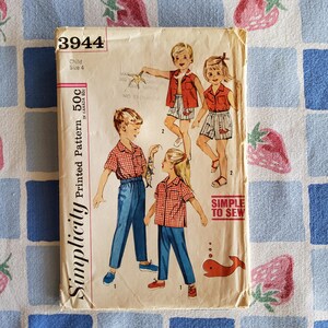 May include: Vintage Simplicity printed sewing pattern for children's clothing, size 4. The pattern features illustrations of children wearing shirts, shorts, and pants. The pattern includes the text "Simple to Sew" and the price.