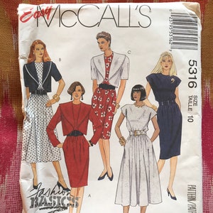 May include: A vintage McCall's sewing pattern for a dress with a bolero jacket. The pattern is for size 10 and is called "Fashion Basics".