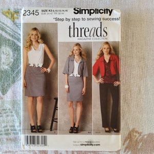 May include: A sewing pattern for a skirt and jacket. The pattern is from Simplicity Threads Magazine Collection and includes sizes K5 8, 10, 12, 14, 16, EUR 34-42, FR 36-44. The pattern shows three different looks for the skirt and jacket, one with a white top, one with a gray top, and one with a red top.