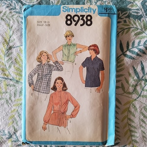May include: Simplicity sewing pattern number 8938 for a half-size blouse. The pattern shows four different styles of blouses with long and short sleeves. The pattern is printed on a white background with blue text and a blue border.