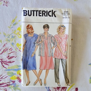 May include: A Butterick 3196 sewing pattern envelope for sizes 8-10-12. The front features illustrations of three outfits: a blue striped dress, a pink dress with a matching striped jacket, and a pink patterned top with grey trousers.