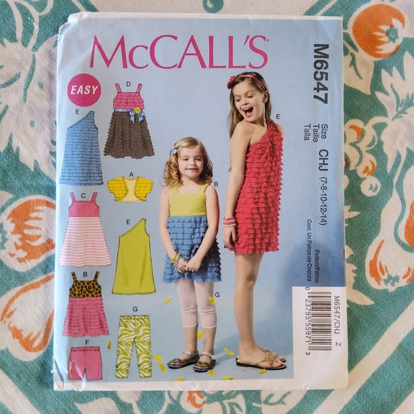 McCalls 6547 Complete Uncut Factory Folds Sewing Pattern Kids Play Casual Clothes Knit Fabrics Dress Skirt Leggings Shorts Size 7-14 26-32