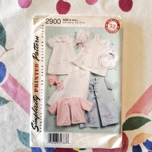 May include: A set of three ceramic mugs with a speckled, matte finish. The mugs are in shades of cream, light gray, and dark gray. Each mug has a simple, minimalist design and a rounded handle.