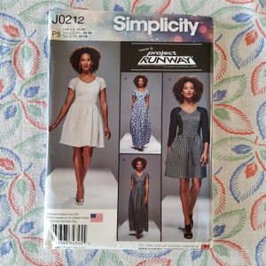 May include: Simplicity sewing pattern J0212, inspired by Project Runway, for sizes US 12-20, EU 38-46, and FR 40-48. The pattern includes four different dress styles: a short white dress with a V-neck and short sleeves, a long floral print dress with a V-neck and short sleeves, a long black and white patterned dress with a V-neck and short sleeves, and a short black and white patterned dress with a V-neck and three-quarter sleeves.
