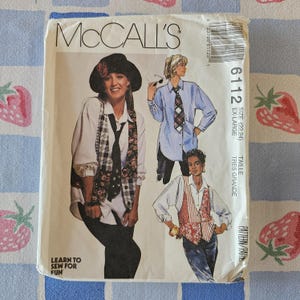 May include: A McCall's 6112 sewing pattern envelope for size extra-large. The cover features illustrations of vests worn over button-down shirts and ties. Text includes 'McCall's', '6112', 'Size (22,24) EX-LARGE', and 'Learn to sew for fun'.