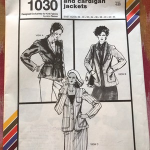 May include: A sewing pattern for a shawl and cardigan jackets. The pattern is for sizes 28 to 44. The pattern is called Stretch & Sew 1030.