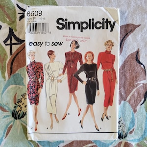 May include: Simplicity sewing pattern 8609, size P (12-16). The pattern features illustrations of dresses in various styles, including a red and black patterned dress, a white dress, a black dress, and a red dress. The text "easy to sew" is also visible.