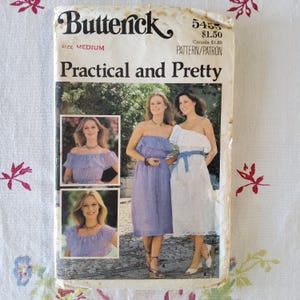 May include: Vintage sewing pattern for a dress, Butterick 5455, size medium, "Practical and Pretty". The pattern shows three women wearing different styles of dresses with off-the-shoulder necklines.
