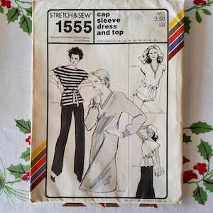 May include: Vintage sewing pattern titled "STRETCH & SEW 1555" for a cap sleeve dress and top. The pattern features illustrations of different garment styles, including a striped top with pants, a dress, and a top with shorts. Bust sizes range from 28 to 44 inches.