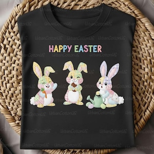 May include: Black t-shirt with a colorful "HAPPY EASTER" text and three cartoon bunnies. The bunnies are in pastel colors, one holding a carrot, another a chocolate egg, and the last one a watering can.