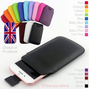 May include: A black leather phone case with a white flap. The case is shown with a smartphone inside. The image shows a variety of colours available for the case, including red, orange, yellow, green, blue, baby blue, lilac, baby pink, hot pink, purple, brown, white, and black. The text "Choice of 14 colours" and "love your phone" is also shown in the image.