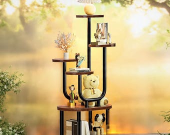 May include: A multi-tiered wooden display shelf with black metal supports. The shelves hold decorative items like a teddy bear, books, figurines, and a lamp. The word "Wood" is visible in the bottom right corner.