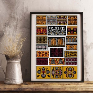 May include: A framed print featuring 18 geometric patterns in black, white, red, and yellow. The designs are inspired by ancient Greek art and architecture.