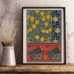 May include: A framed print with a colorful floral pattern. The top section features a repeating pattern of yellow and blue flowers on a green background. The bottom section features a repeating pattern of red, blue, and green flowers on a red background.