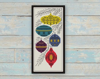 May include: A framed illustration of five colourful Christmas baubles hanging on a pine branch. The baubles are decorated with geometric patterns and are in shades of yellow, blue, purple, red, and green.