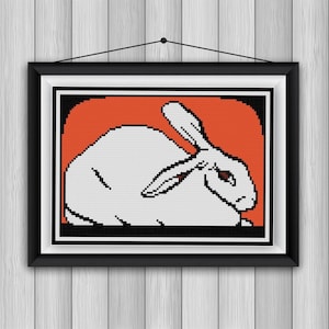 Liegendes Kaninchen Kreuzstichmuster PDF orange schwarz weiß Anfängermuster Julie De Graag