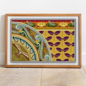 May include: Framed art print featuring a colorful, stylized design. The artwork includes a circular motif with a bird, fish, and wave pattern, along with a section of dragonfly and frog illustrations. The background is a mustard yellow.