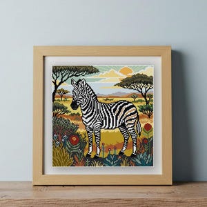 May include: A framed cross-stitch embroidery featuring a black and white zebra standing in a savanna landscape. The scene includes acacia trees, a yellow sun, and colorful flowers in the foreground, all rendered in a detailed pixelated style.