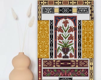May include: A framed cross-stitch artwork featuring a floral design in a vase, with a decorative border. The color palette includes shades of brown, gold, burgundy, and white. The artwork has a vintage, handcrafted aesthetic.