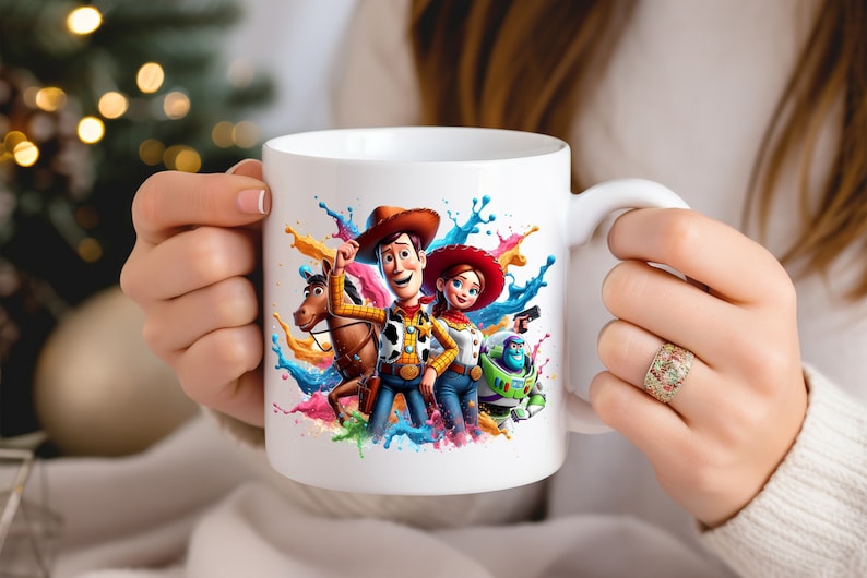 May include: White ceramic mug with a colorful paint splatter design featuring Woody, Jessie, and Buzz Lightyear from Toy Story.