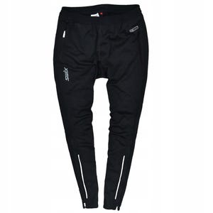 May include: Black athletic pants with white stripes down the sides and a zipper pocket. The brand name "swix" is printed in white on the left leg. The pants are designed for outdoor activities.