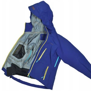May include: A blue hooded jacket with yellow and turquoise accents. The jacket has multiple zippered pockets and a gray interior lining. The hood has the letters "HH" in a gold color. The jacket is designed for outdoor activities.
