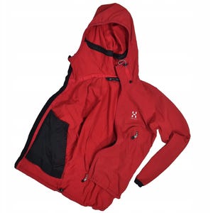May include: A red hooded jacket with a black interior and accents. The jacket has a zipper closure, a hood, and a small logo on the chest. The jacket is made of a lightweight material.