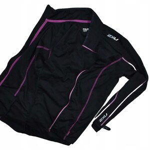 May include: Black long-sleeve athletic shirt with purple accent stripes and the brand name "2XU" in white. The shirt has a collar and a zipper. The design is streamlined for athletic performance.