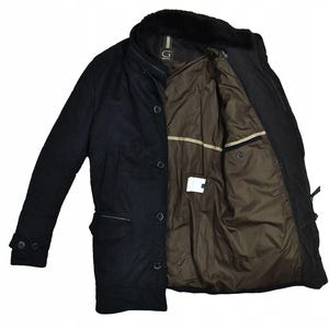 May include: A black, button-down coat with a faux fur collar. The coat has a brown interior lining and a small pocket. The coat is open, revealing the interior lining. The coat has a label with the letter "G" on it.