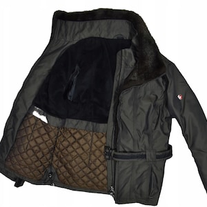 May include: A dark grey winter jacket with a faux fur collar. The jacket features a quilted brown lining and a black belt. The jacket is open, showing the interior. A small emblem is visible on the upper sleeve.