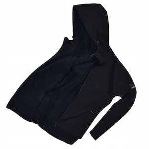 May include: Black hooded jacket with a full-length zipper and a dark blue interior lining. The jacket has a hood with a drawstring and a small logo on the sleeve. The jacket is open, revealing the interior lining.