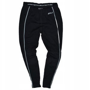 May include: Black athletic leggings with a white stripe down the sides. The leggings have the text "HUMAN PERFORMANCE. MULTIPLIED" across the waistband and the brand logo "2XU" on the left leg.