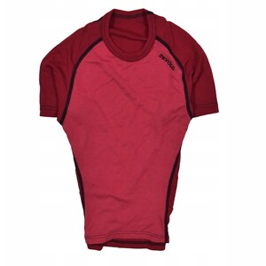 May include: A short-sleeved, red t-shirt with darker red sleeves and a crew neck. Black stitching accents the seams and the word "Devold" is printed on the upper left sleeve. The shirt is made of a soft, breathable material.