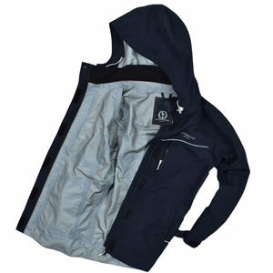 May include: Navy blue hooded jacket with a light gray interior. The jacket has a zipper closure, multiple pockets, and the brand name "JEAN PAUL" is visible on the chest. The jacket is open, revealing the interior lining and a tag.